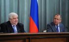 Russian FM Sergei Lavrov (R) speaks during a joint press conference with his Syrian counterpart Walid al-Moualem. (AFP)