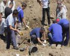 The mass grave is estimated to hide about 1,000 bodies of Bosnian war victims, as anthropologists uncover about 15 bodies a day.