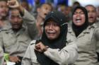 A detained youth cries as she sings a song during a religious class at Sekolah Polisi Negara, a police school in Seulawah, Aceh Besar, Indonesia’s Aceh province on Wednesday. Police detained about 65 youth punks when they attended a rock music show on December 11. The youths are expected to be released on Friday 23 after completing disciplinary education. (Reuters Photo)