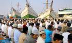 Indonesian Muslims offer Eid Al-Fitr prayers at the historic Sunda Kelapa port in Jakarta. (AFP)